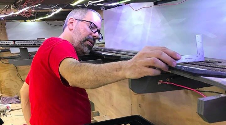 Jason Shron participating in model railroading.