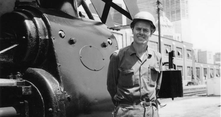 John C. Clarke at the Roundhouse, early 1970s. Posing in front of a steam locomotive
