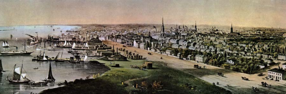 aerial view of Toronto as a small city by the lake. Church spires are the tallest thing in the skyline