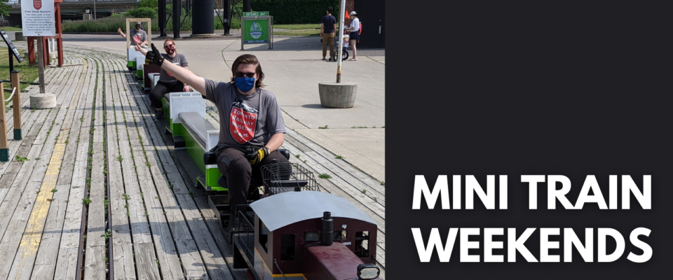 Musuem staff members prepare the miniature train for the mini train weekends this summer