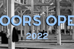 Historic photo of industrial building interior. Text read Doors Open 2022