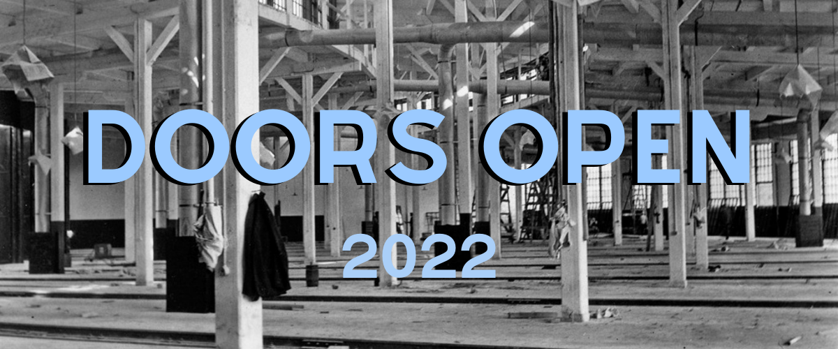 Historic photo of industrial building interior. Text read Doors Open 2022