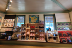 gift shop shelves stocked with hats and toy trains