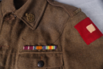 Military uniform jacket with ribbons, patches
